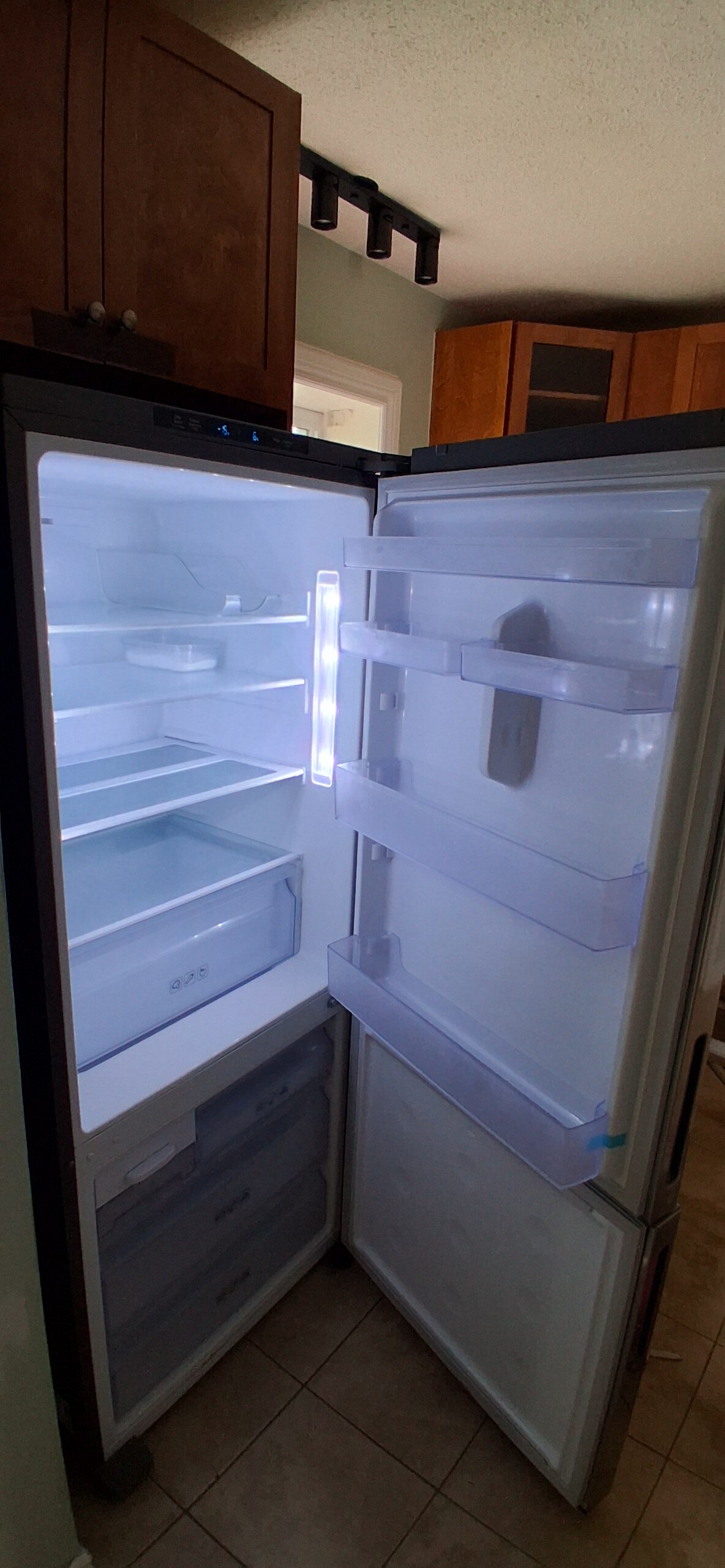 Refrigerator door before adjustment in Ottawa — FixItAll Handyman Services