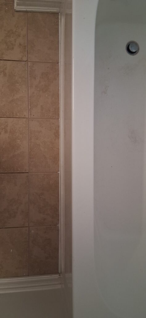Bathroom Floor Tile Repair by Bathtub in Ottawa — FixItAll Handyman Services