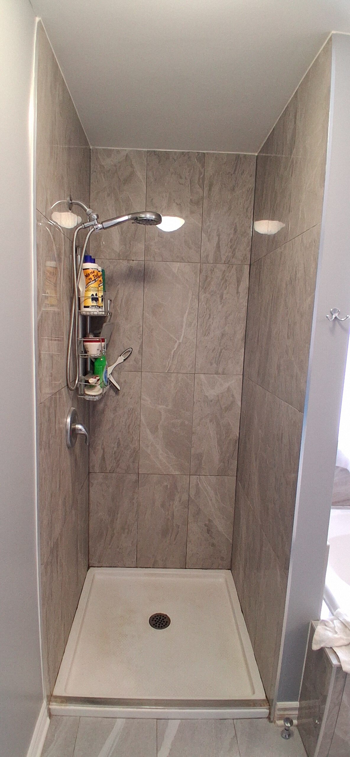 Old shower entrance before glass door replacement in Ottawa