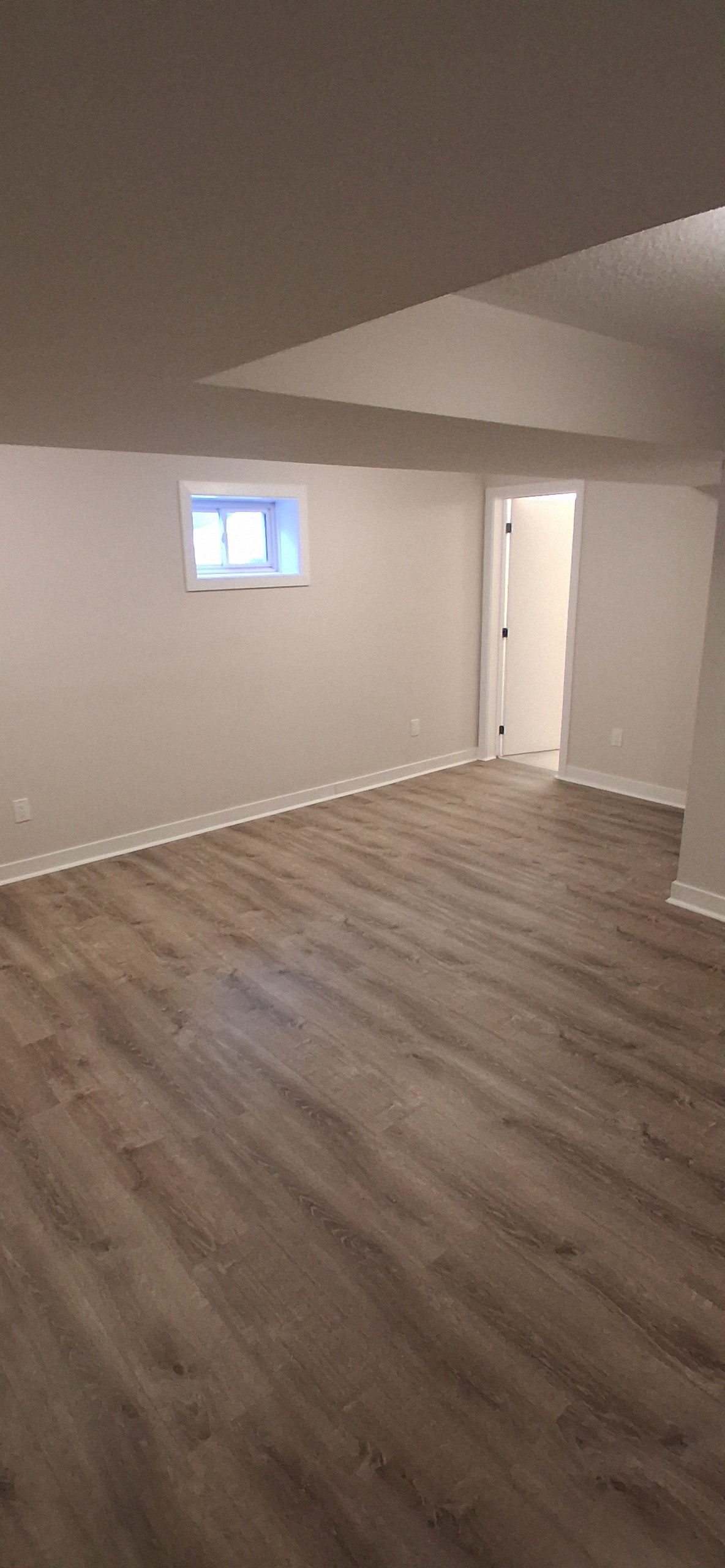 Damaged laminate flooring being replaced in an Ottawa home during laminate floor replacement service.
