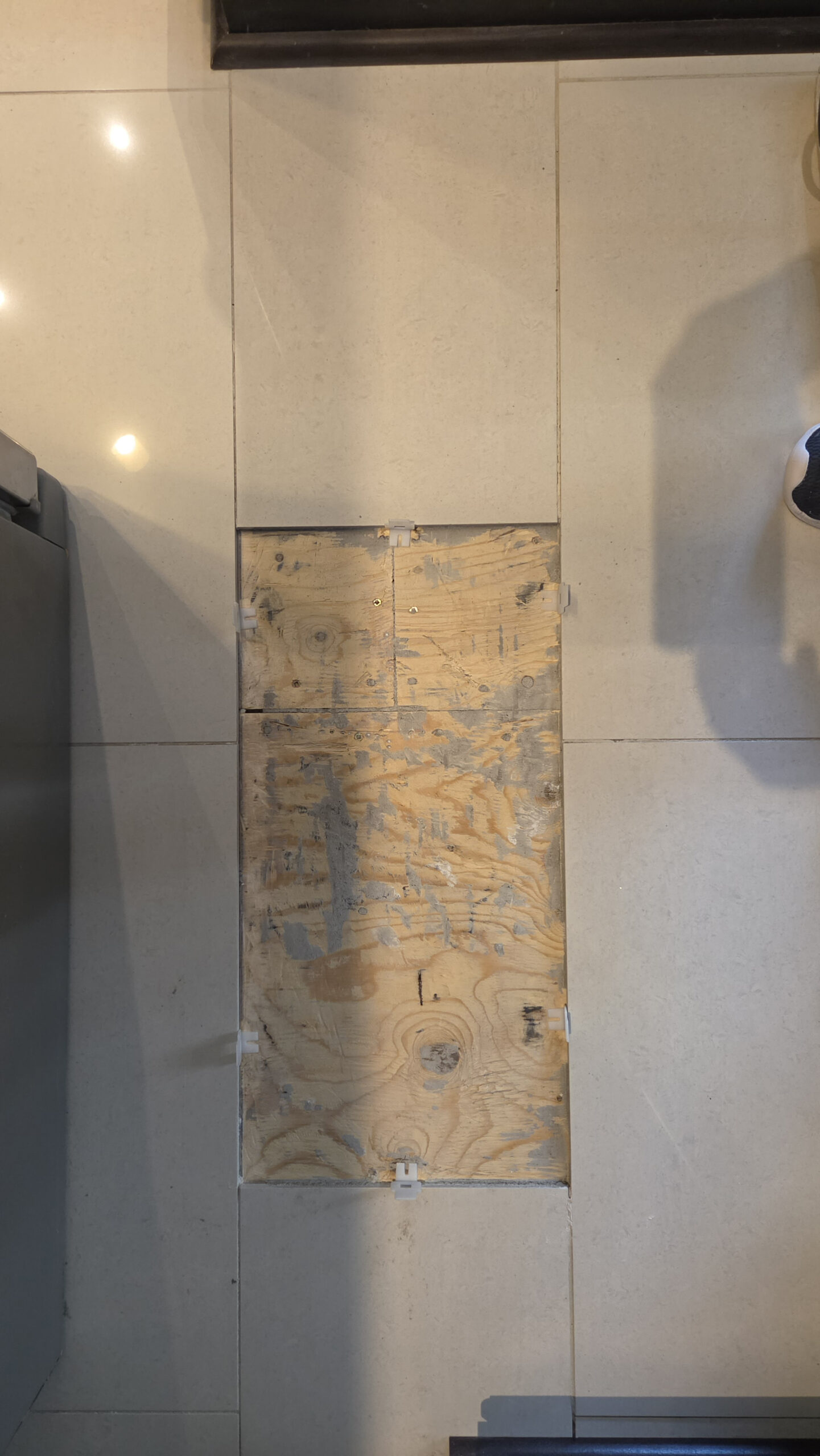Broken individual tile before replacement